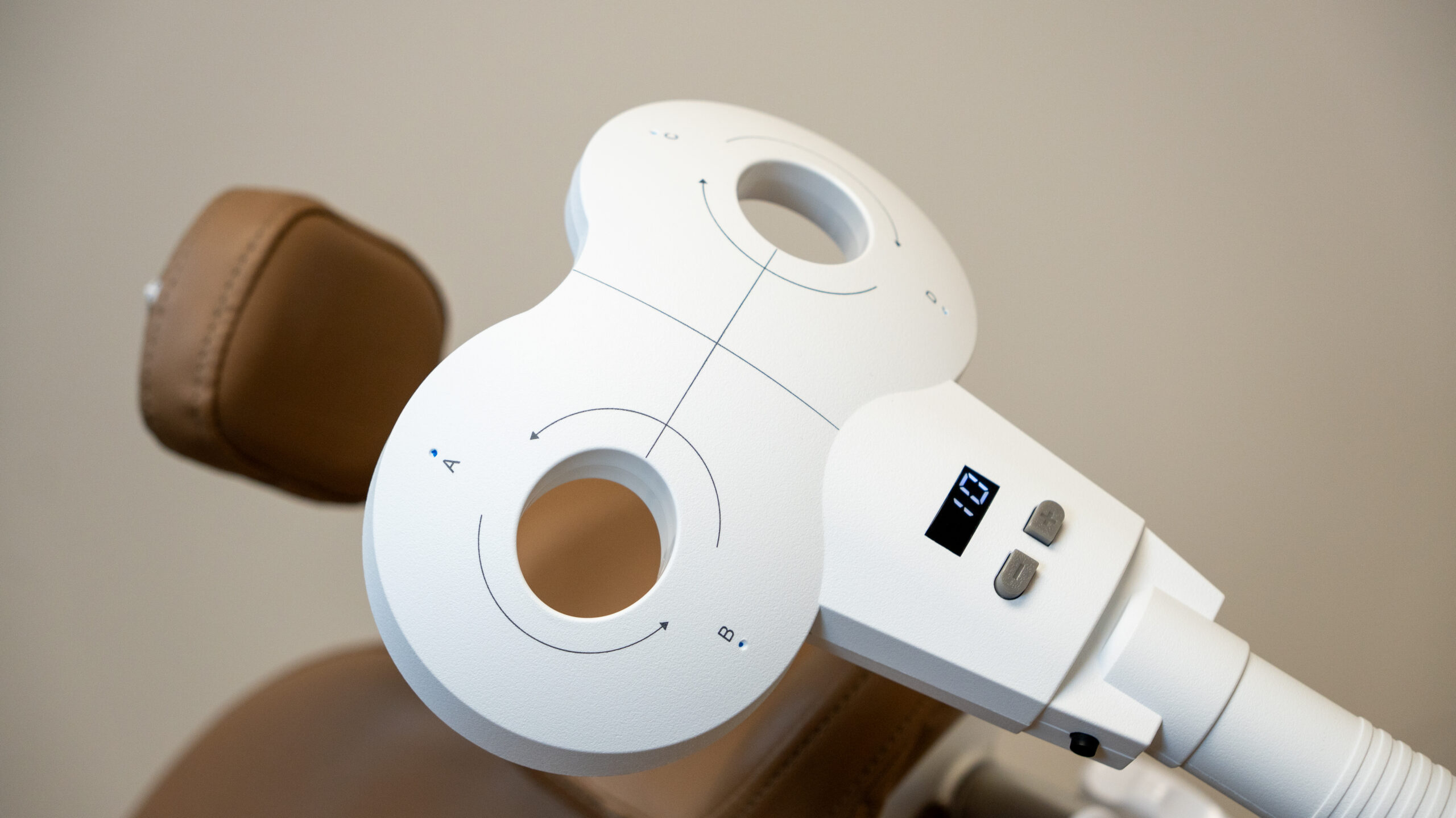 The Liquid Double Cone Coil on its positioning arm over the treatment chair